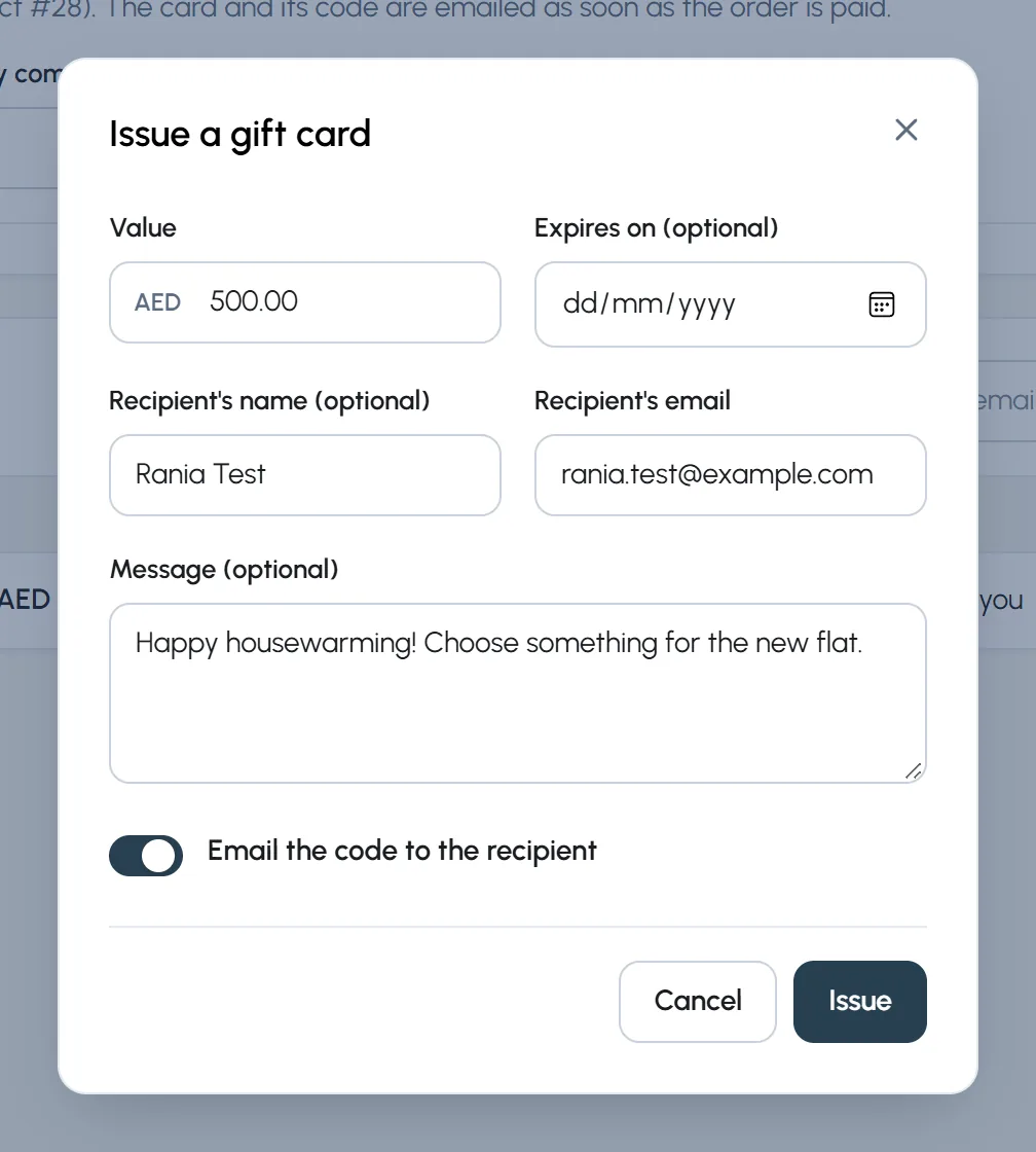 The Issue a gift card window: value AED 500, recipient Rania Test, a housewarming message and Email the code to the recipient.