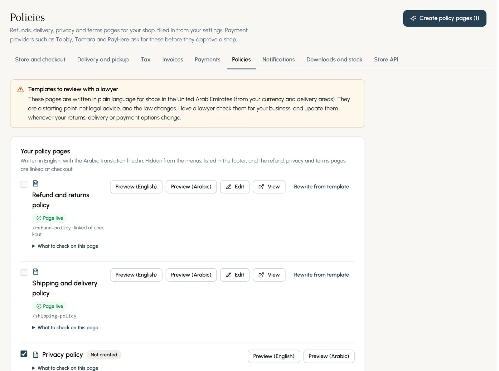 The Policies tab: a reminder to review them with a lawyer, and the refund, shipping, privacy and terms policies with their status, previews in English and Arabic, Edit and Rewrite from template.