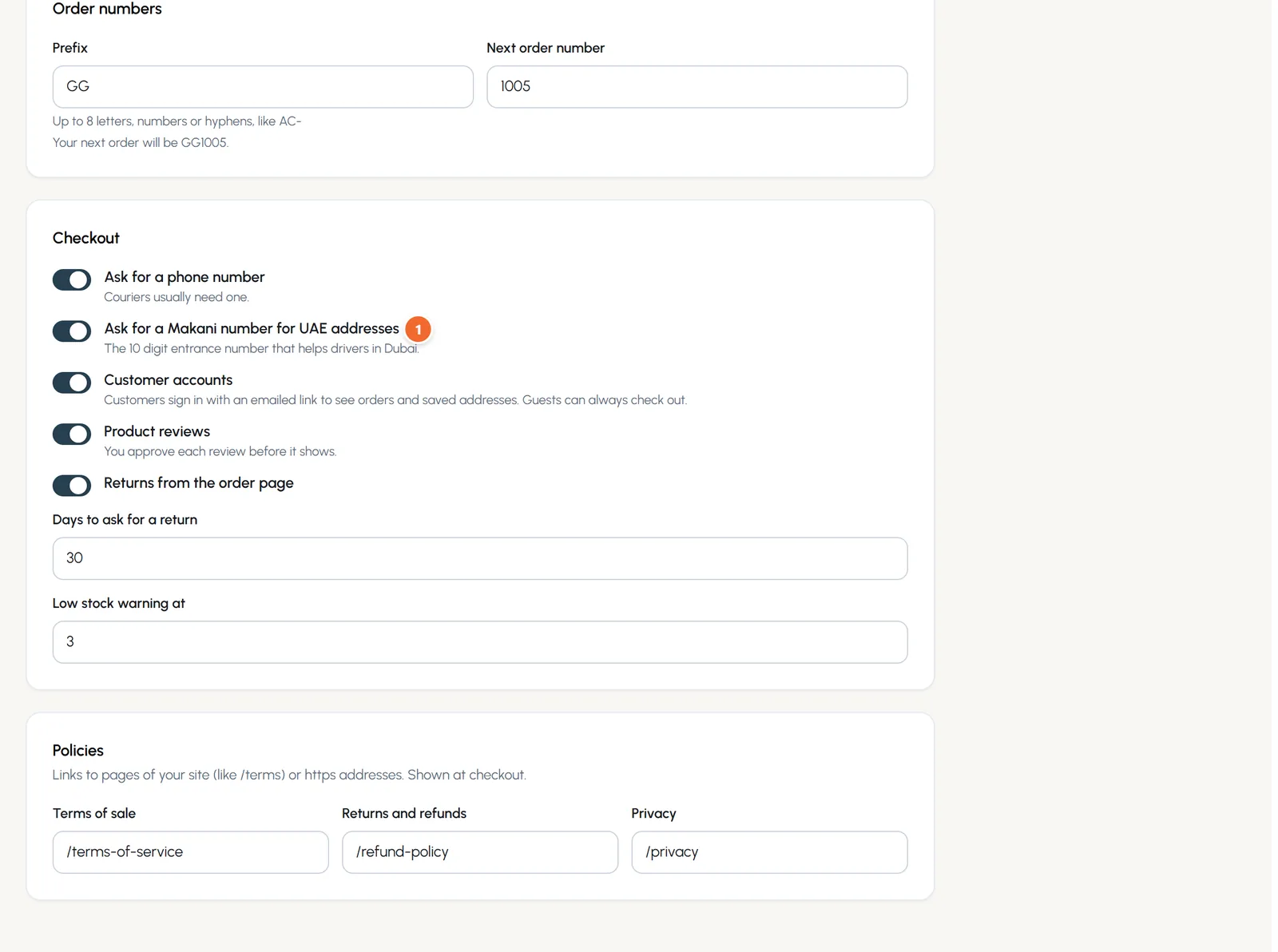 The Checkout part of Store and checkout: switches for phone number, Makani number, customer accounts, product reviews and returns, the return days and low stock level, and the policy links.