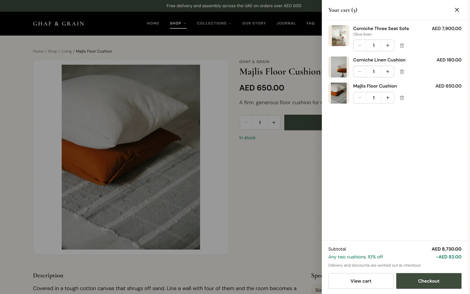 The cart panel open at the side with three items, the automatic cushion discount and Checkout.